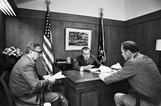 Henry A. Kissinger with subordinates